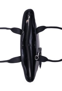 Black handbag with two handles, zippered compartments, and a lined interior featuring a zigzag pattern. Smooth texture with silver hardware.