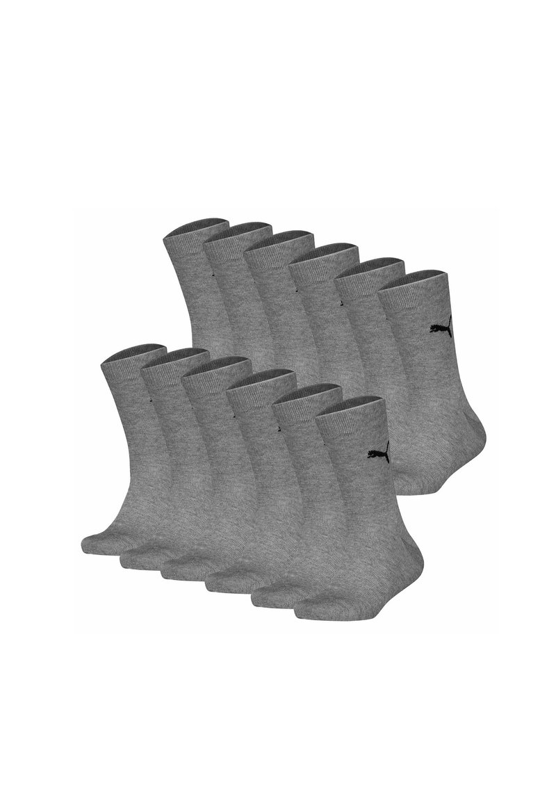 Calcetines de algodón gris hasta el tobillo, con un puño acanalado y un pequeño logo negro. El paquete incluye múltiples pares. Forma estándar y textura flexible.