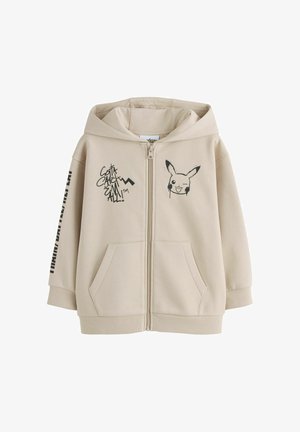 Smėlio spalvos džemperis su užtrauktuku, kapišonu, priekinėmis kišenėmis, Pikachu veido grafika, ant krūtinės užrašas „Gotta Catch 'Em All!“ ir juodu užrašu kairėje rankovėje.