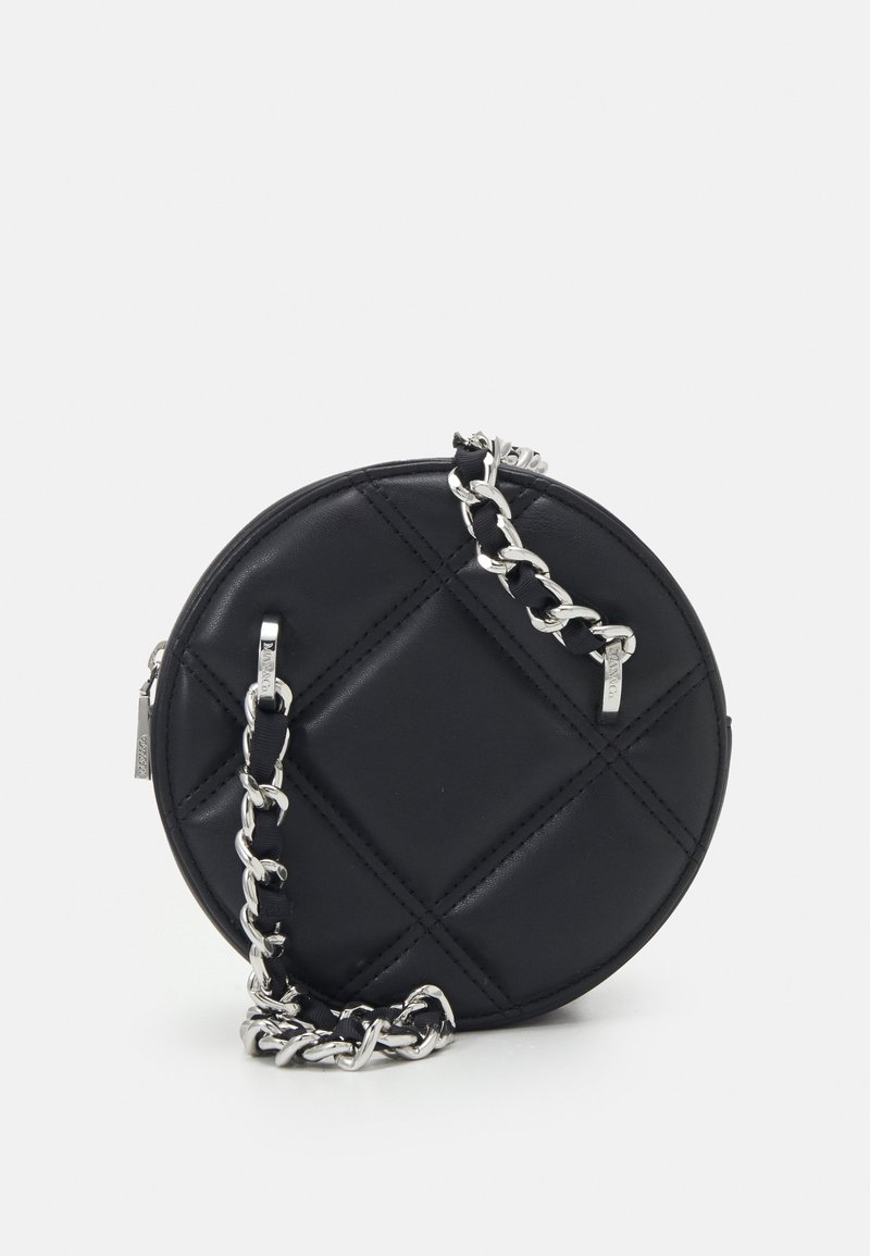 Round black leather bag featuring quilted design, silver chain strap, and zip closure. Smooth texture with prominent stitching detail.