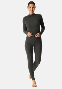 Donkergrijs set met lange mouwen en leggings van een zachte, gladde stof. Heeft een hoge nek en een aansluitend ontwerp, geschikt voor het dragen in lagen of voor huiselijk gebruik.