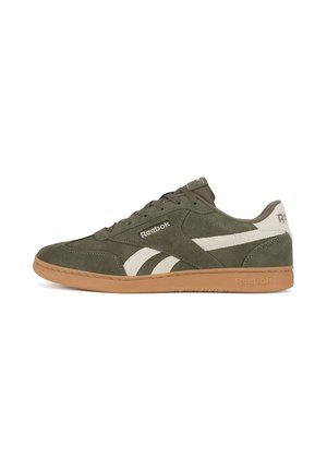 Low-top Reebok sneaker in olive green suede with white stripes and gum rubber sole, side view.
