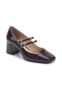 Zapato Mary Jane de charol púrpura oscuro brillante con dos correas en el tobillo, punta cuadrada y un tacón ancho. Forro interior suave.