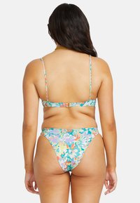 Multicolored bikini with floral patterns; adjustable thin straps; hook closure at the back; high-cut bottom; smooth material.