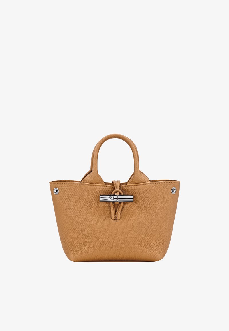 Tan leather handbag with textured finish, rounded dual handles, and silver-tone toggle hardware at the front.