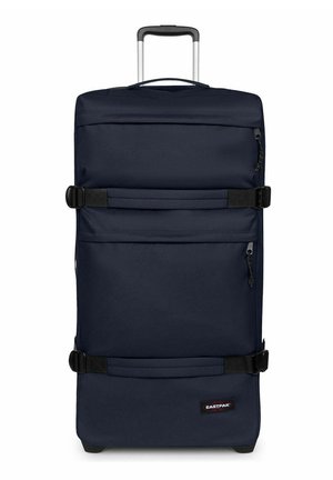 Maleta alta azul oscuro con ruedas, asa telescópica, dos correas laterales, dos bolsillos con cremallera y logo de Eastpak en la esquina inferior delantera.