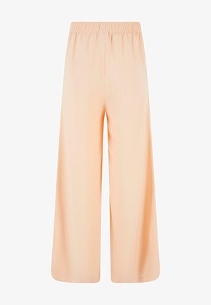 Ferskenfargede vidde bukser med elastisk midje. Laget av glatt stoff, med løs passform og uten lommer.