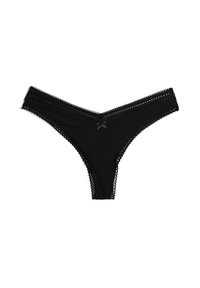 String en dentelle noire avec une taille festonnée, tissu texturé et un petit nœud sur le devant. Design à dos ouvert.