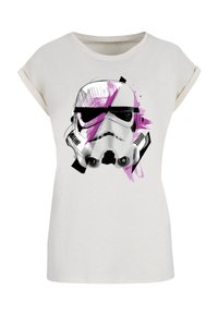 White cotton t-shirt featuring a graphic design of a stormtrooper helmet with black sunglasses and pink splashes, short rolled sleeves.