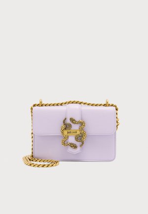 Lavender leather crossbody bag with gold chain strap and intertwined gold snake clasp featuring "just cavalli" logo.