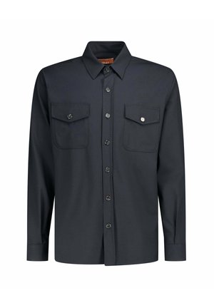 Chemise bleu marine foncé à boutons, manches longues, col ouvert et deux poches avant à rabat avec boutons.