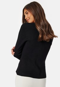Bubbleroom KNITTED TRUMPET SLEEVE CARDIGAN - Kardigan - black