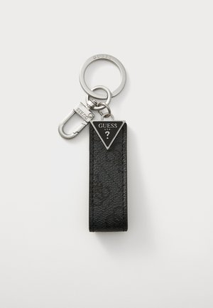 Black leather keychain with a triangular silver pendant featuring "GUESS USA" text. Attached metal ring and clip for key attachment.
