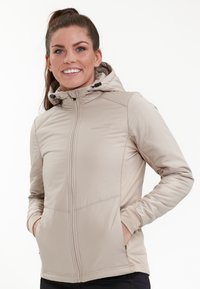 Lys beige zip-up jakke med hætte, som har en glat tekstur, sidelommer og elastiske manchetter. Diskret branding på forsiden.