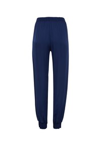 Marineblaue, elastische Bundhose mit schmal zulaufenden Beinen, die gesammelte Bündchen und eine glatte, leichte Stofftextur aufweist.
