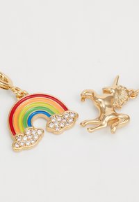 Gold-colored charms featuring a rainbow with red, orange, green, blue, and yellow sections, and a unicorn figure, both with decorative details.