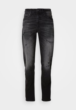 Jeans in denim nero con un lavaggio sbiadito e dettagli strappati. Presentano un design tradizionale a cinque tasche, passanti per cintura e una vestibilità dritta.