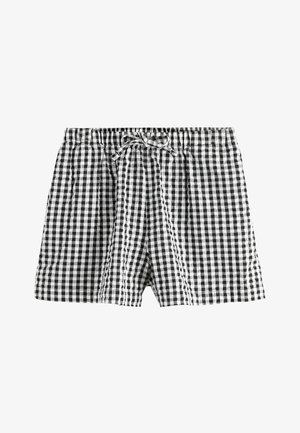 Sort- og hvidternet stofshorts med elastisk talje og snøre foran.