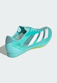Lightweight running shoe in turquoise with mesh upper, white stripes, and green outsole. Features streamlined design and minimal cushioning.
