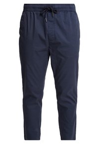 Pantalon décontracté bleu marine avec ceinture élastique et cordon noir, coupe droite, fabriqué en tissu léger.