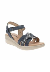 Sandalo blu navy con tacco a zeppa, impreziosito da strass sulla cintura, dotato di una cinghia alla caviglia con fibbia e di una soletta imbottita.
