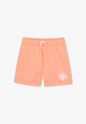 Shorts de bain couleur saumon avec taille élastique, cordon de serrage blanc et logo Timberland blanc sur la partie inférieure de la jambe droite.