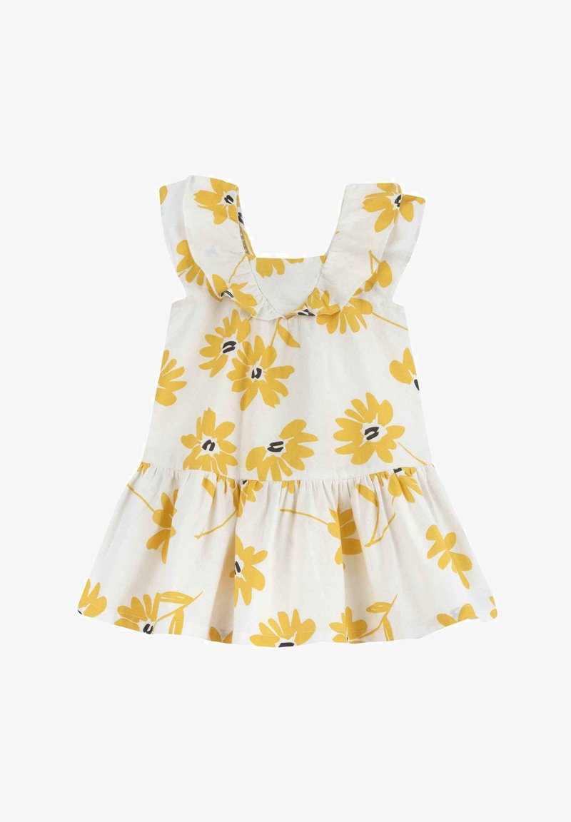 Vestido de algodón con un patrón floral amarillo sobre un fondo blanco, con tirantes con volantes y una falda fruncida.