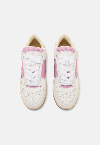 White sneakers with pink mesh side panels, perforated toe, and white laces. Textured soles and a smooth finish on the upper material.