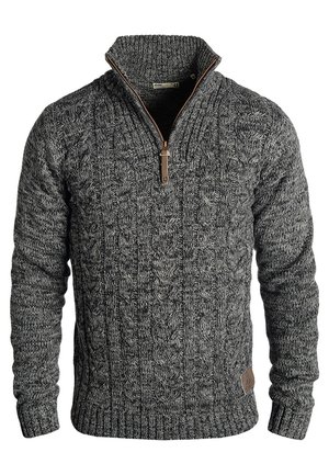 Cable-knit sweater in dark gray with a high collar. Features a front zipper with brown accent. Ribbed cuffs and hem. Textured fabric.