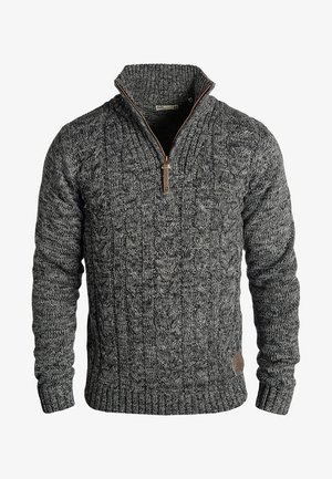 Cable-knit sweater in dark gray with a high collar. Features a front zipper with brown accent. Ribbed cuffs and hem. Textured fabric.