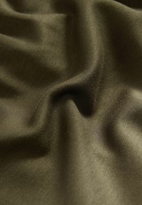 Olive green, smooth fabric with subtle sheen, displaying soft, flowing folds. No patterns or distinct textures visible.