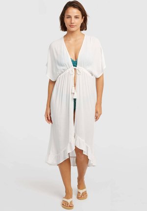 Biely prehoz s krátkymi rukávmi, zvýrazneným pásom a detailmi so strapcami. Má volánový lem a ľahkú, priesvitnú látku.