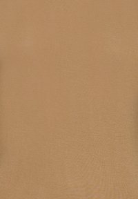 Surface texturée marron clair uniforme, sans personnes, objets ou actions visibles.