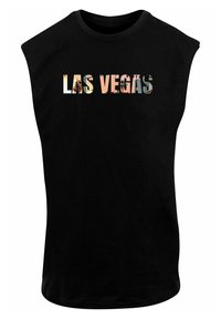 Melna bezmaku T-kreklu ar uzrakstu "LAS VEGAS" daudzkrāsainos burtiem, kuros iekļautas attēli. Gluda tekstūra.