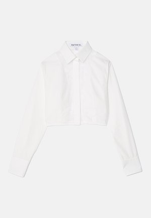 Λευκό κοντομάνικο πουκάμισο με κολάρο, μακριά μανίκια, κλείσιμο με κουμπιά και λεπτομέρειες από υφασμάτινη πλάκα. Φτιαγμένο από λείο, πλεχτό ύφασμα.