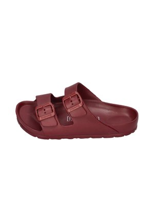 Single red slide sandal with two adjustable buckle straps and contoured footbed shown from the side on a white background.