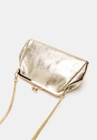 Bata Vakarsomiņa - gold coloured