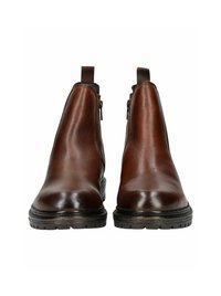 Botas de tobillo de cuero marrón con un acabado suave, paneles laterales elásticos y una suela de goma texturizada. Detalle de cremallera en ambos lados.