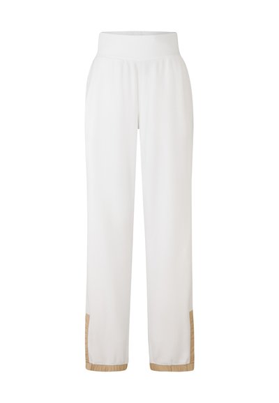 Hvide sweatpants med en bred talje, der har en tekstureret kant og beige detaljer forneden. Fremstillet af blødt, letvægtsstof.