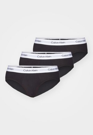 Culottes en coton noir, lot de trois, avec logo Calvin Klein blanc sur la ceinture élastique. Texture lisse, coupe classique.