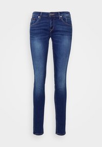 Skinny jeans made from dark blue denim, featuring a mid-rise waistband, front pockets, and a smooth texture with minimal fading.