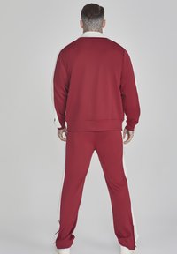 SIKSILK CREST - Tracksuit bottoms - burgundy
