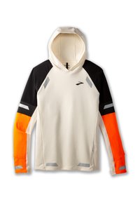Hoodie i krämfärg med svarta axlar och orangea ärmar. Har reflekterande detaljer och en texturerad yta.