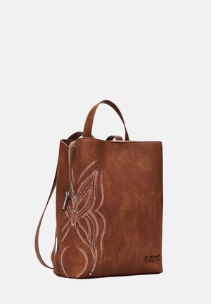 Braune Leder-Tragetasche mit gesticktem Blumenmuster, Reißverschluss und kurzen Griffen. Enthält ein markiertes Detail auf der Vorderseite.