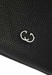 Black textured leather wallet featuring a silver interlocking G logo as a notable detail. The material has a pebbled finish.