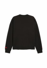 Maglione nero a maniche lunghe realizzato in tessuto morbido, con colletto e polsini a coste, e un piccolo accento rosso sulla parte inferiore del maniche sinistro.