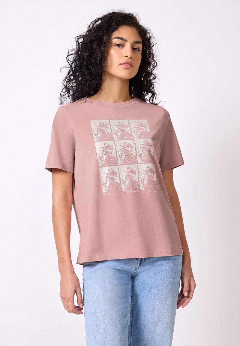 Rosa bomulls t-shirt med grafisk tryck av nio dinosauriebilder och text, med avslappnad passform och korta ärmar.