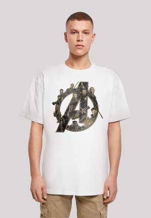 White cotton t-shirt featuring a large black and gold Avengers logo graphic with character illustrations and detailed textures.