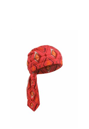 Red headscarf with orange and gray geometric diamond patterns, tied at the side with a long hanging tail.