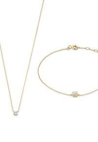 Collier et bracelet en or avec un petit accent en diamant. La chaîne est délicate avec une finition brillante et un fermoir en homard. Design classique.